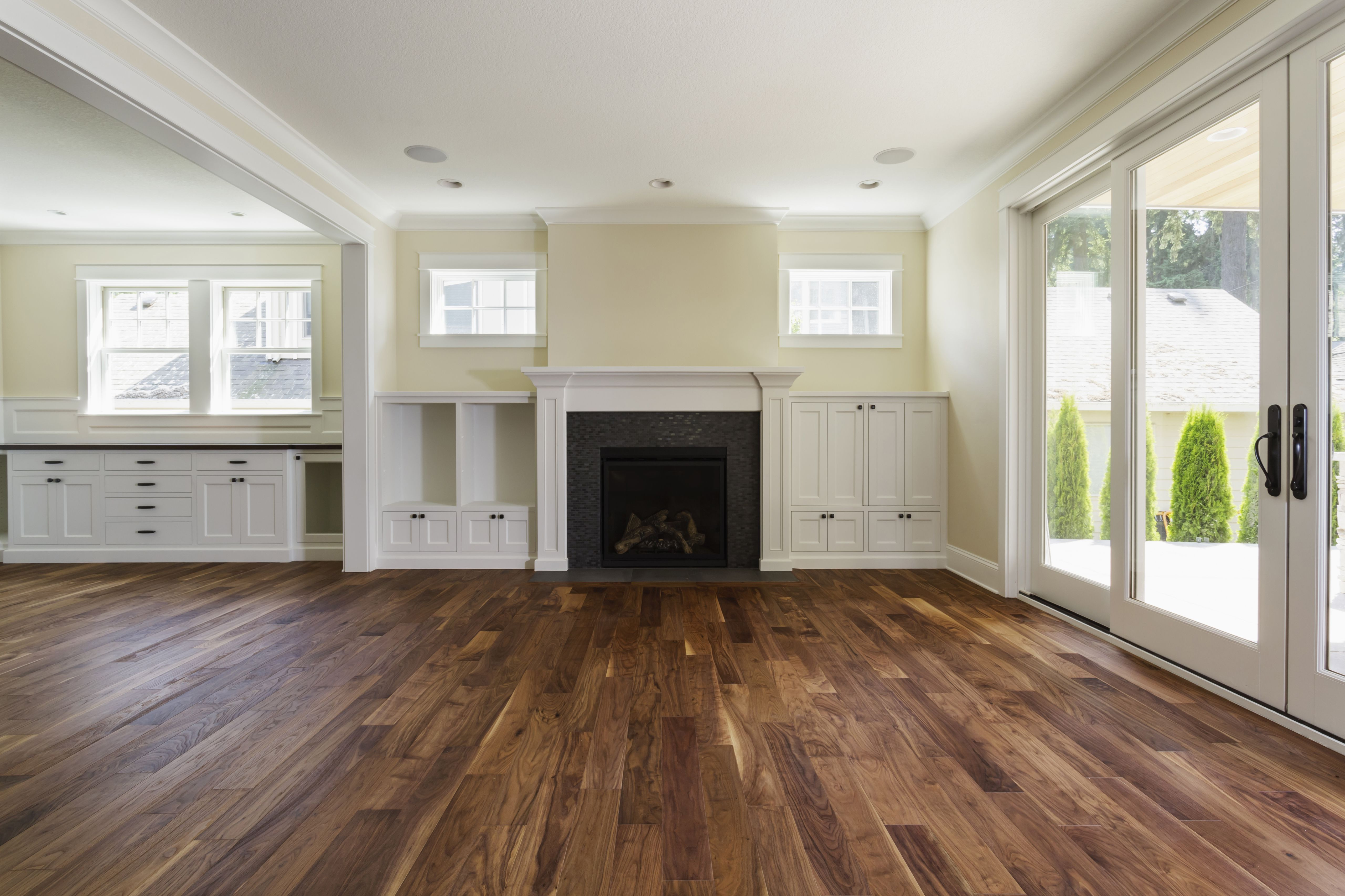 3 1 4 white oak hardwood flooring of the pros and cons of prefinished hardwood flooring regarding fireplace and built in shelves in living room 482143011 57bef8e33df78cc16e035397