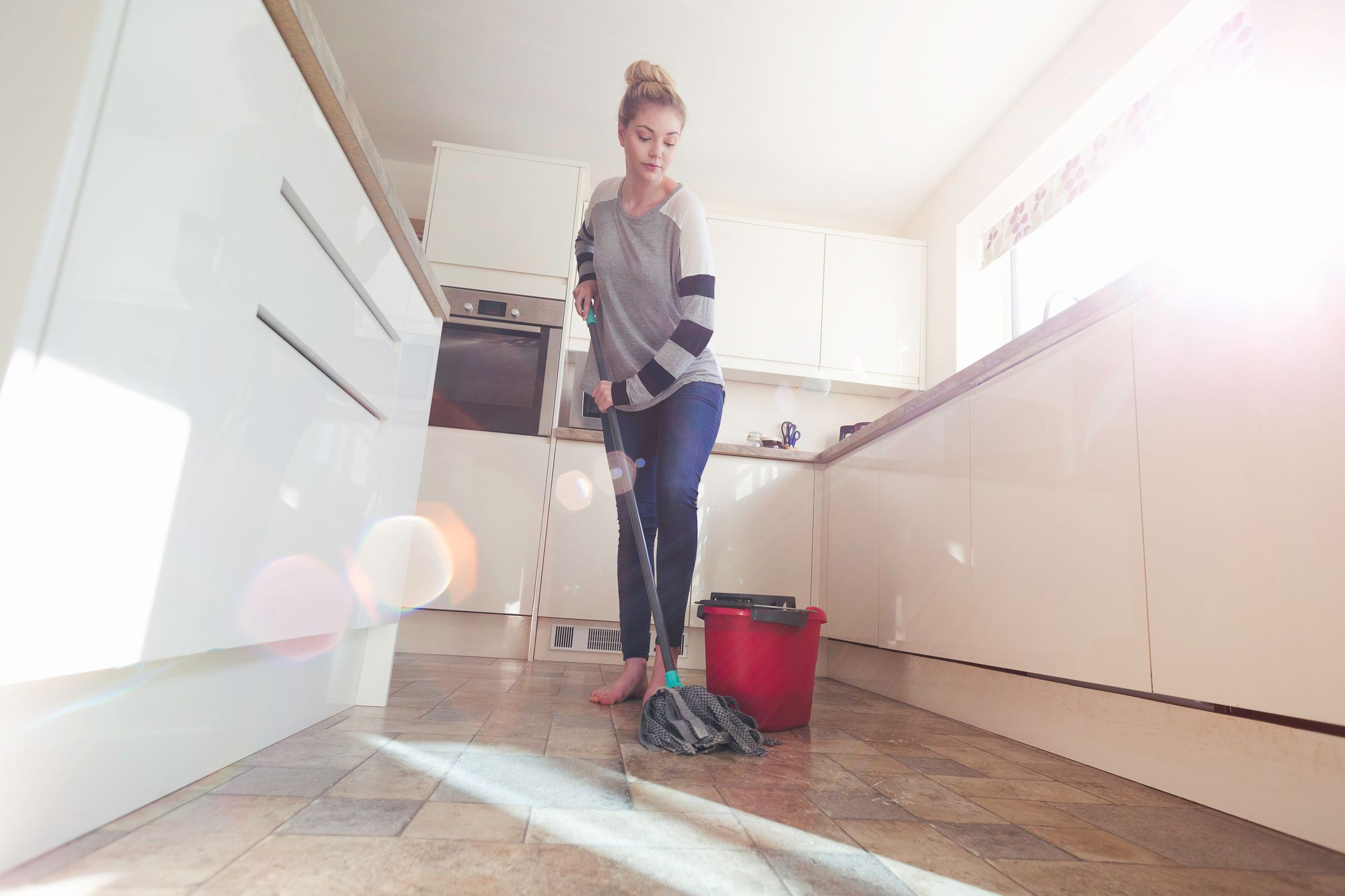 best hardwood floor vacuum under $100 of easy homemade mopping solutions regarding woman mopping floor gettyimages 499652484 58937d343df78caebcbeee89