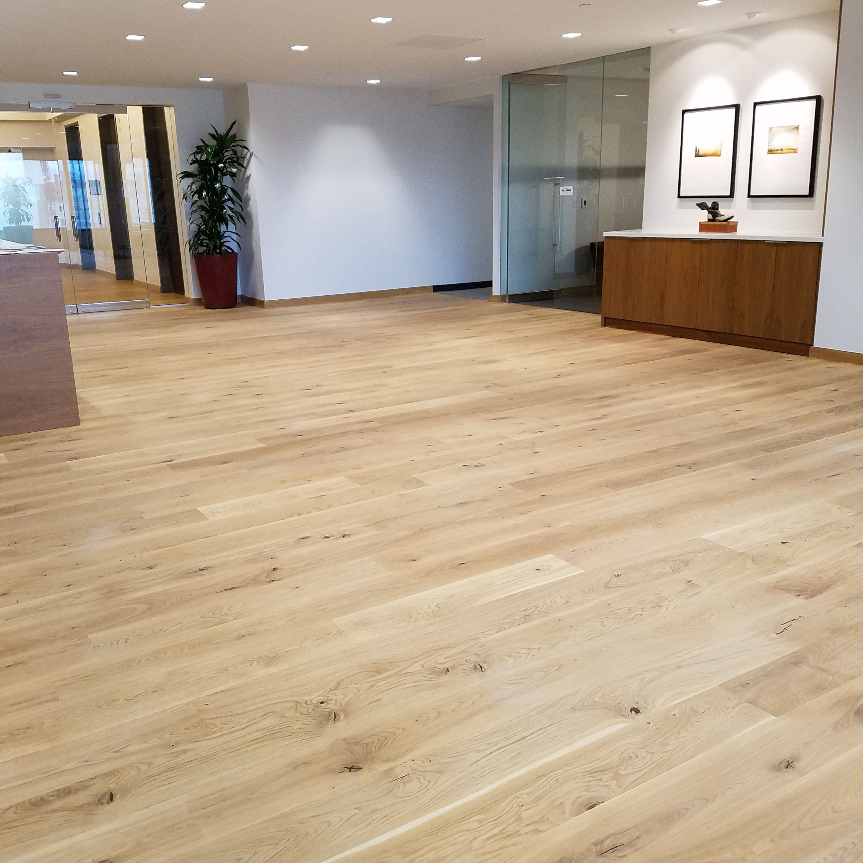 custom hardwood floor patterns of castlebespokeflooring gracing this modern looking office space be with be it for a professional office space or a residence these 8 wide hardwood planks can be lightly sanded coated and custom pre finished as per