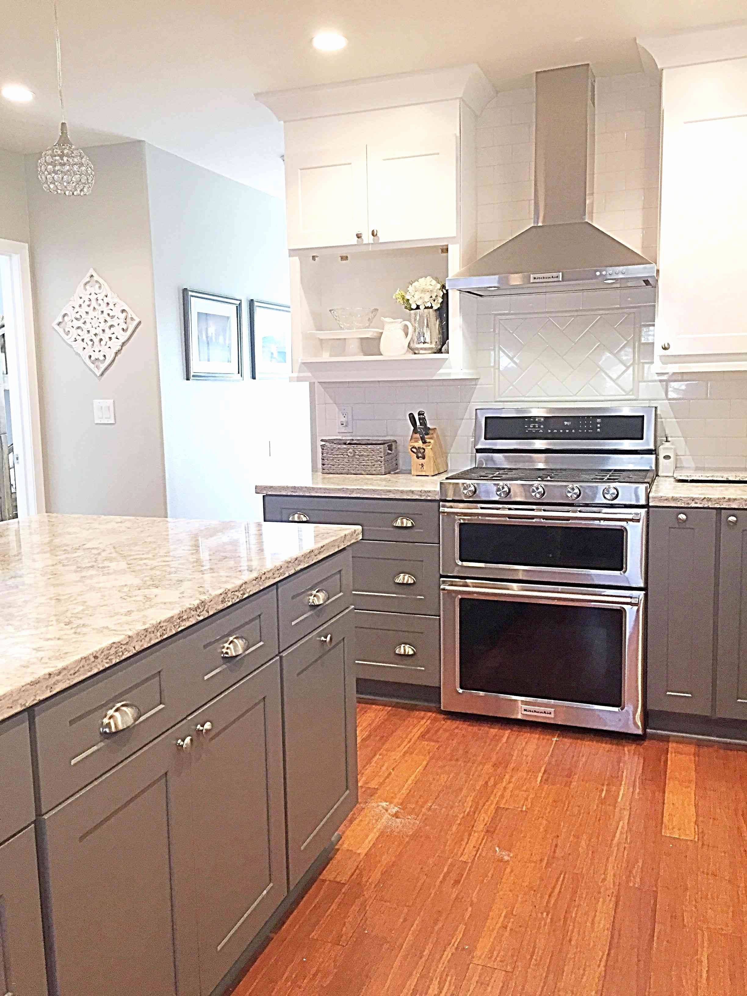 Kitchen With Dark Wood Floors And White Cabinets