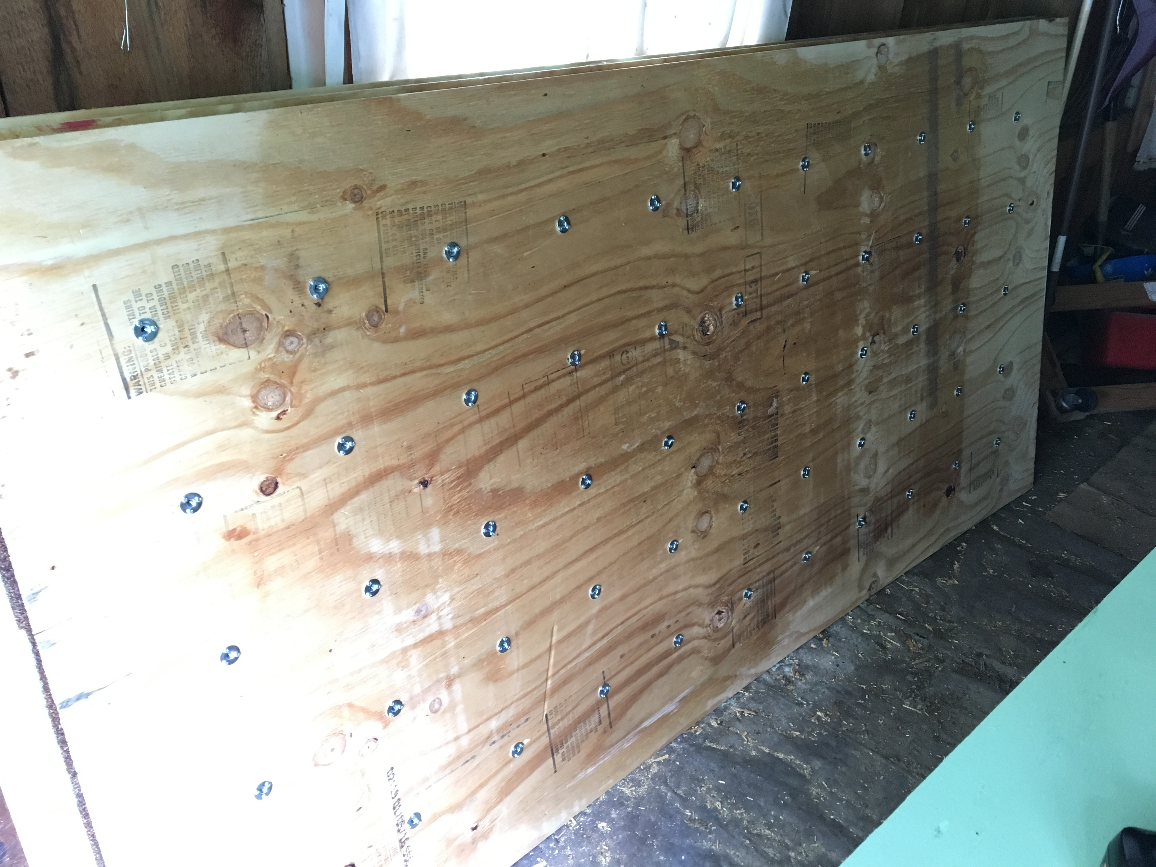 diy hardwood floor of my diy bouldering wall album on imgur within 55 t nuts per board 3 screws per nut 6 sheets of ply two of the boards had 6 rows instead of 5 1056 screws and 352 holes that sucked but id rather