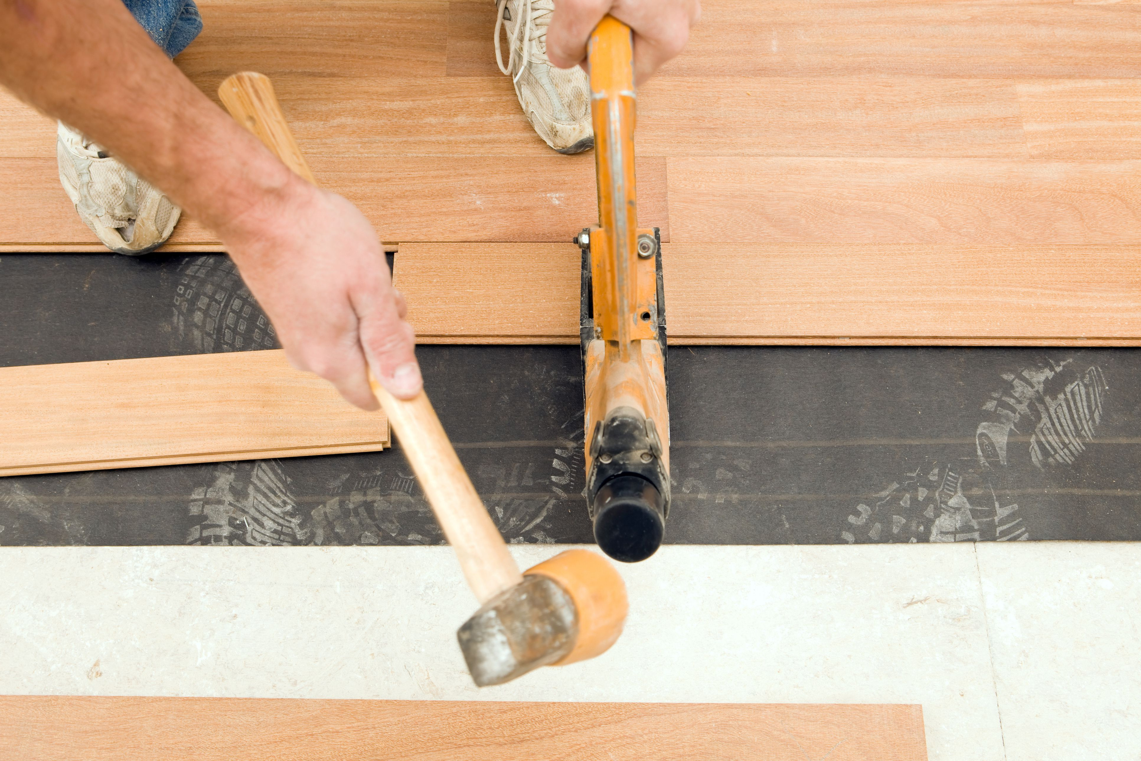 gray hardwood floor examples of the hardest wood flooring you can buy pertaining to worker installing new cumuru hardwood floor 186852280 5827f3bc5f9b58d5b11372fc