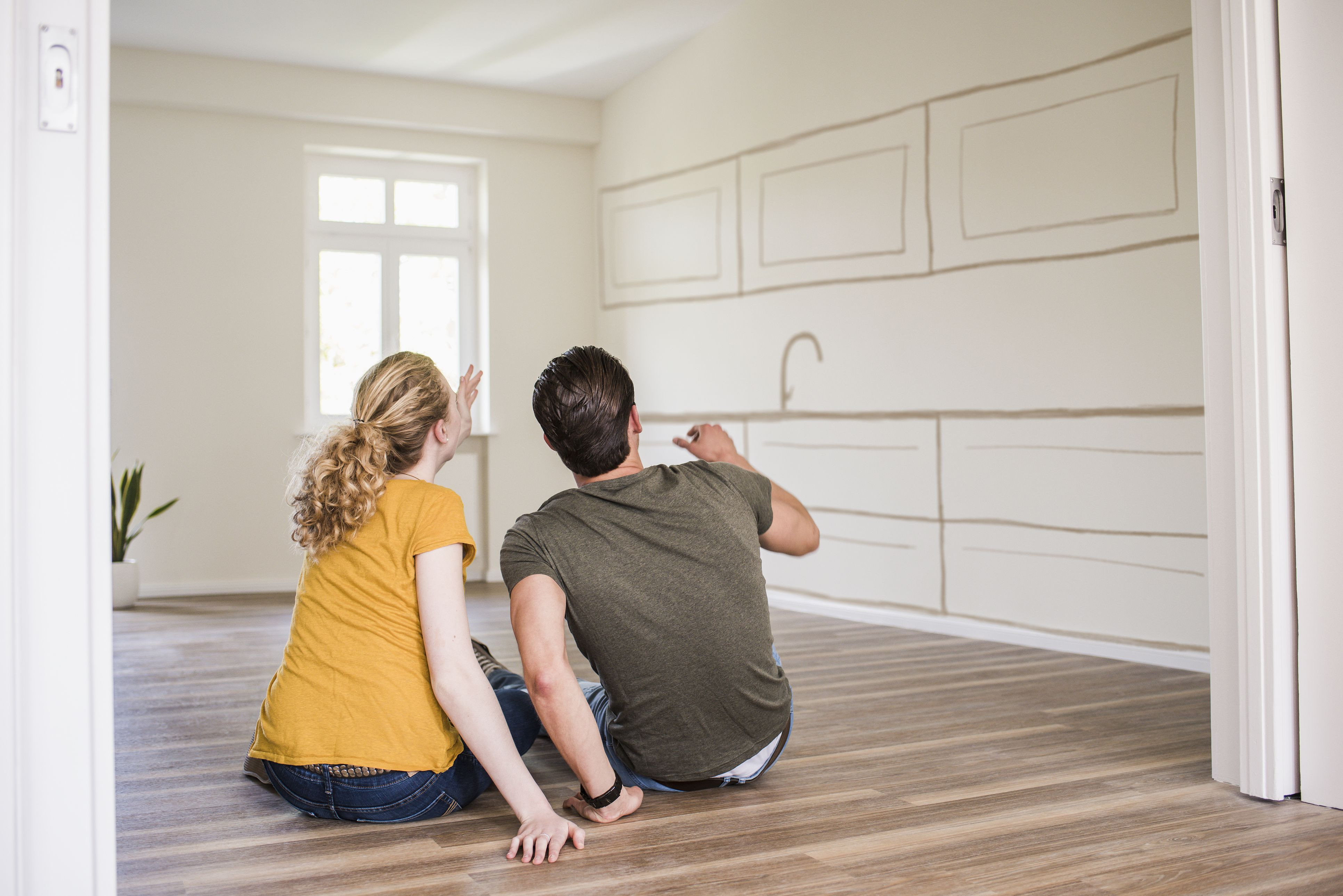 hardwood floor repair nyc of make money flipping short sales inside young couple in new home sitting on floor thinking about interior design 748332925 5ab54bfc1f4e130037503648