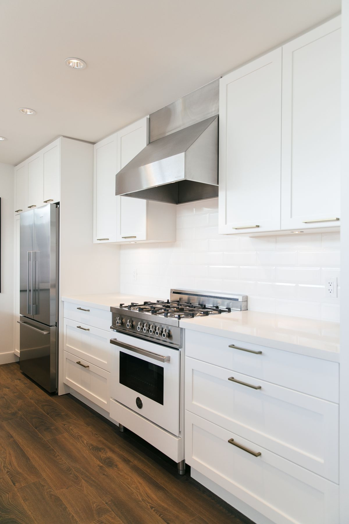 hardwood flooring auction calgary of bertazzoni range for modern kitchen design ideas with stainless throughout range hood white kitchen design ideas with white bertazzoni range and stainless steel range hood plus wooden flooring also recessed ceiling lighting