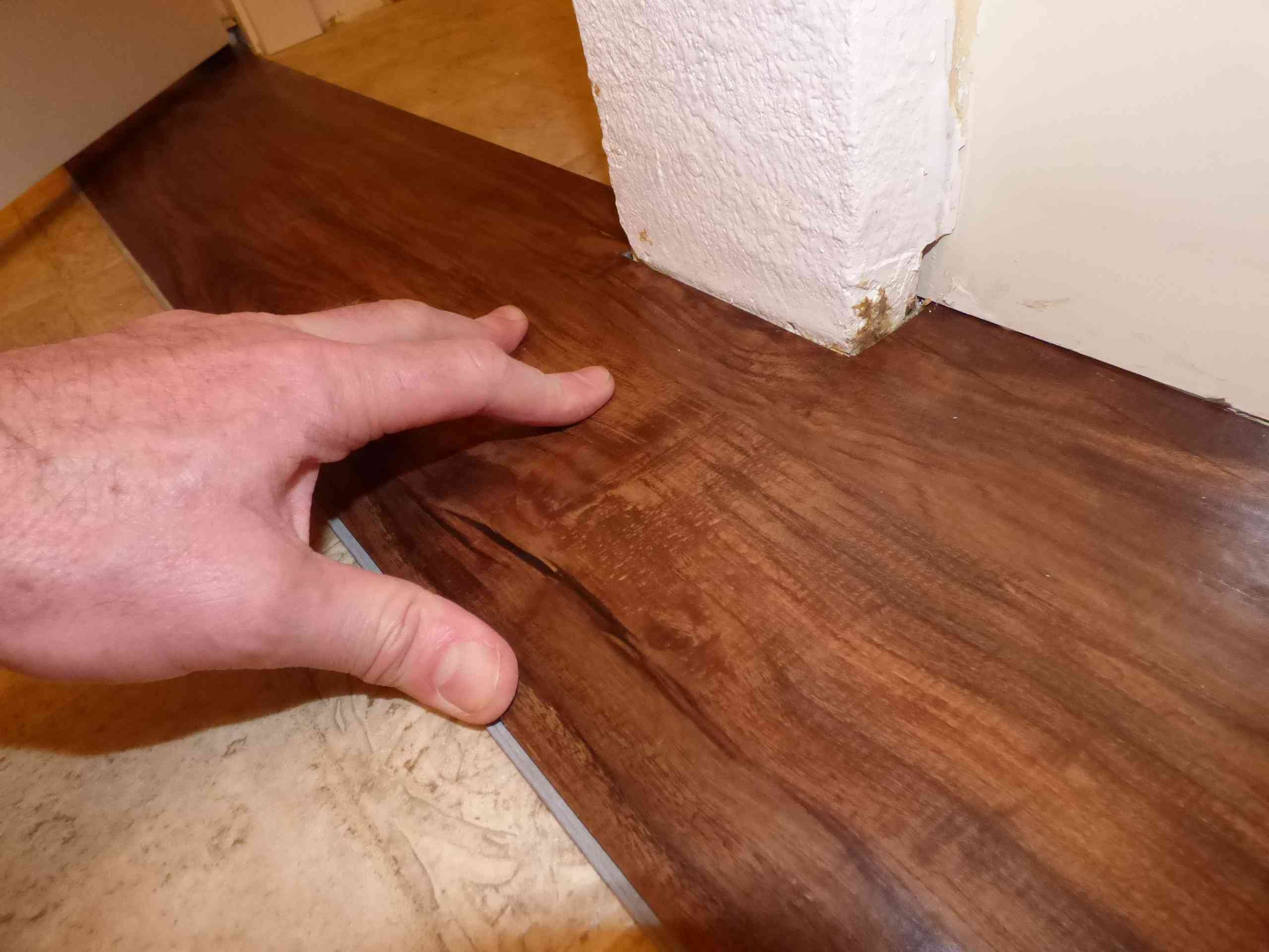 how much to put hardwood floors in 1200 sq ft of its easy and fast to install plank vinyl flooring regarding fitting plank around protrusions 56a4a04f3df78cf7728350a3 jpg