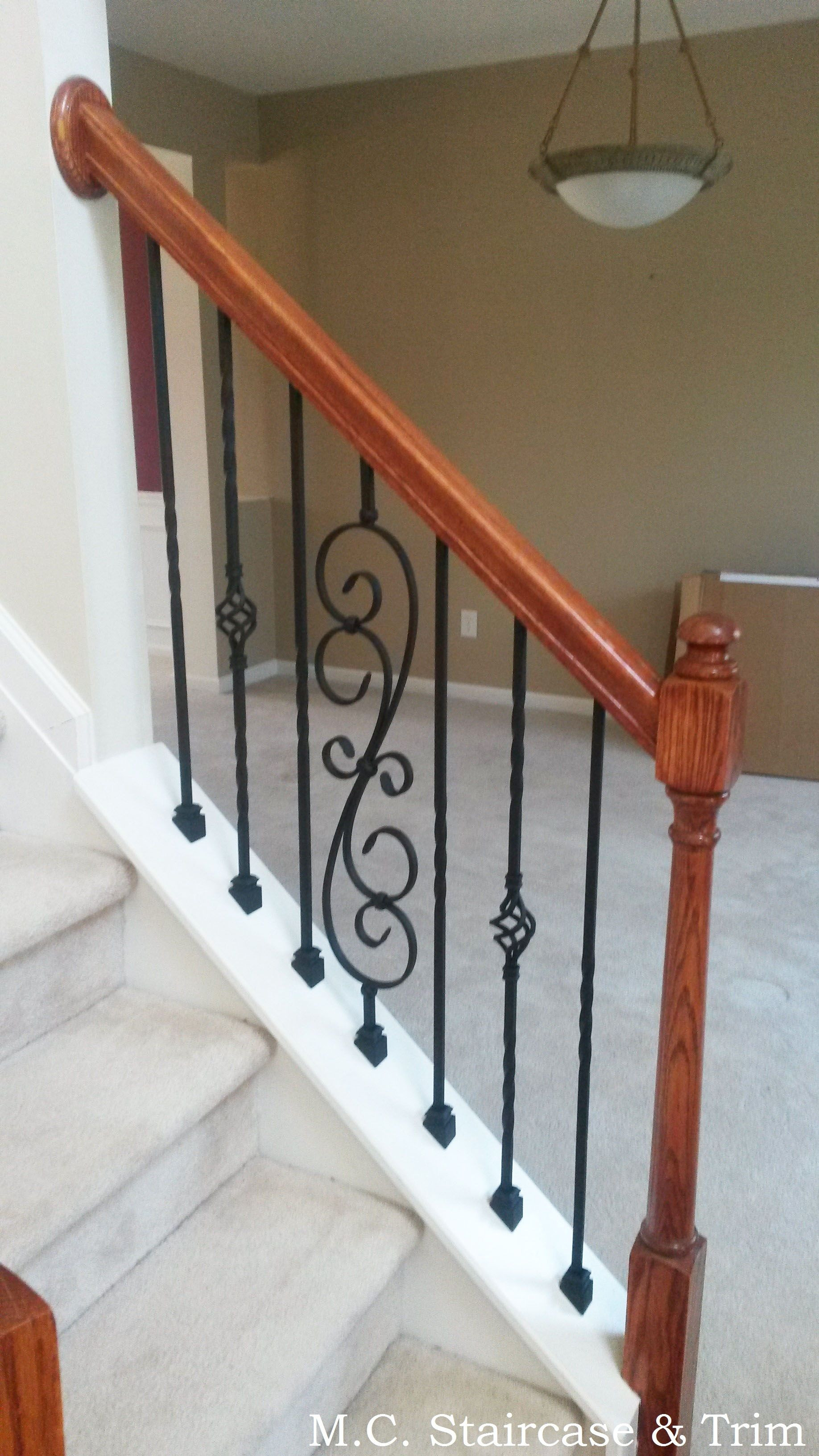 install hardwood floor around stairs of iron baluster upgrade from m c staircase trim removal of wooden with iron baluster upgrade from m c staircase trim removal of wooden balusters and installation of alternating twist series single twist and single basket