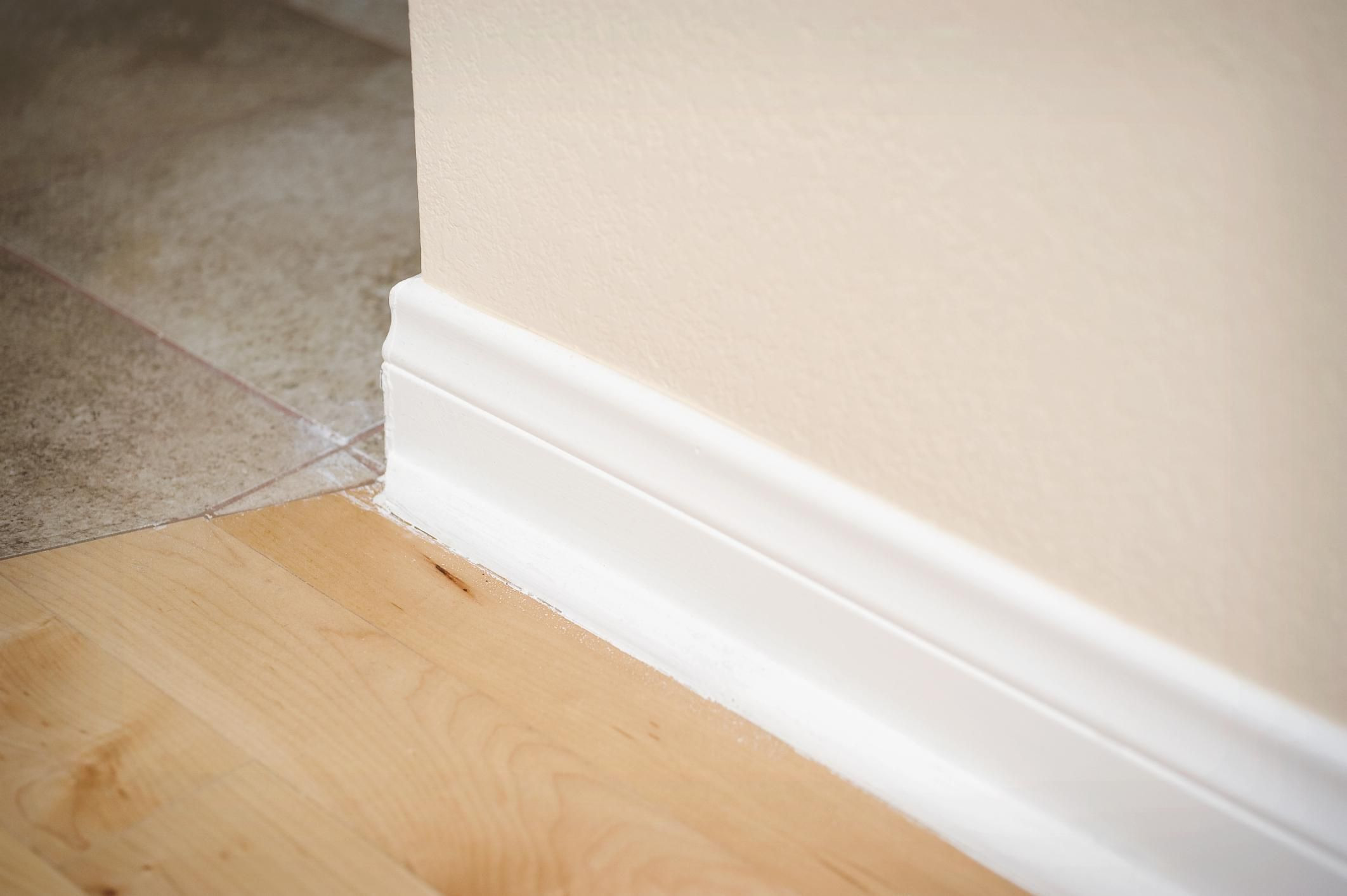 painting hardwood floors this old house of how to paint baseboards advice and hacks with 150207475 56a49f1b5f9b58b7d0d7e0d6