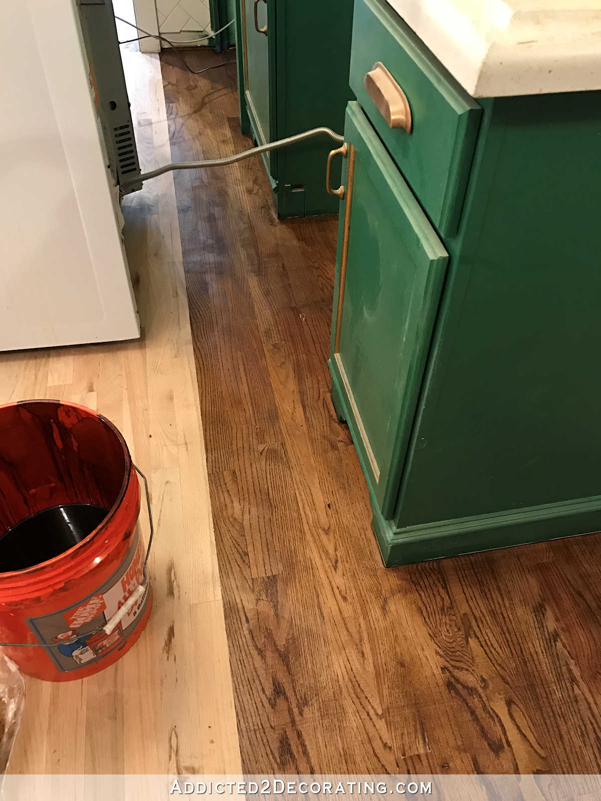 redoing hardwood floors diy of adventures in staining my red oak hardwood floors products process for staining red oak hardwood floors 10 stain on kitchen floor behind stove and refrigerator