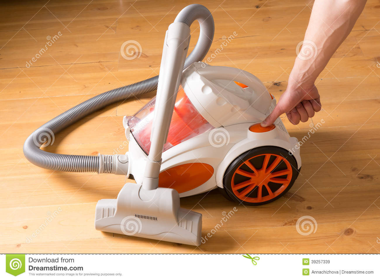 vacuum cleaner for hardwood floors of closeup of a hand to turn on the vacuum cleaner man is unrecogn with closeup of a hand to turn on the vacuum cleaner man is unrecogn